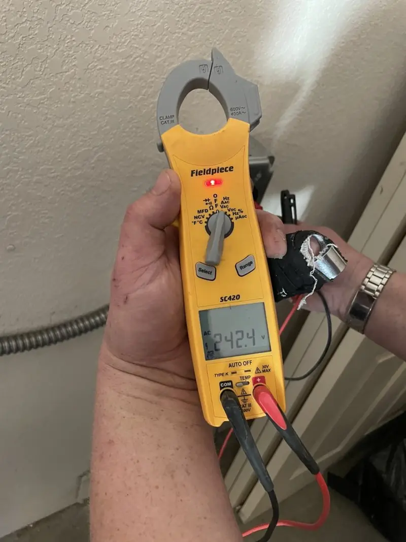 Voltage testing with clamp meter during Hot Tub / Pool Electrical Wiring in Webster